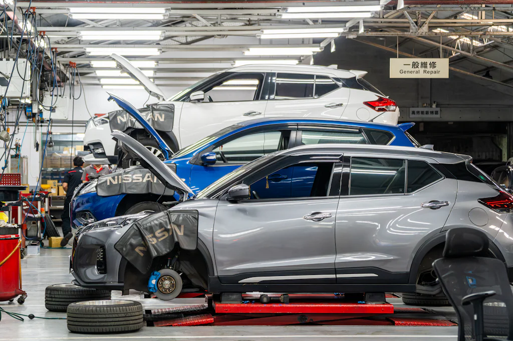 Vehicles up on lifts in a working service bay