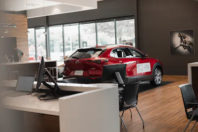 A service advisor's desk on a clean showroom floor