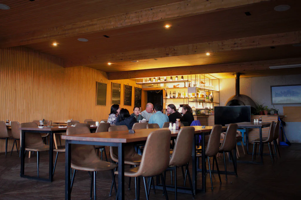 Guests being served along a restaurant bar