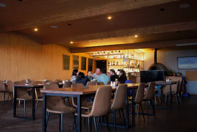 Guests being served along a restaurant bar